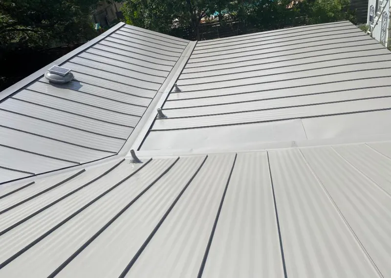 Solar attic fan installed on a metal roof for Roof Ventilation in West Jordan